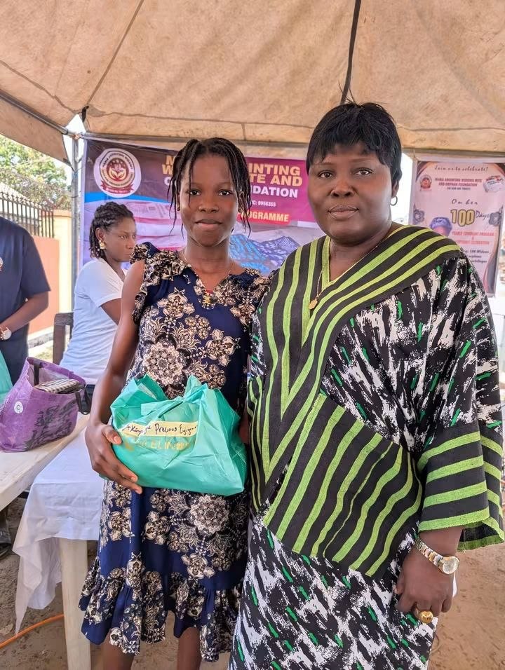 A young person holding a package at a foundation programme